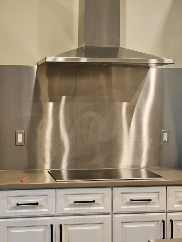 20230329_114932 Range with Commercial size vent and brown quartzite countertops